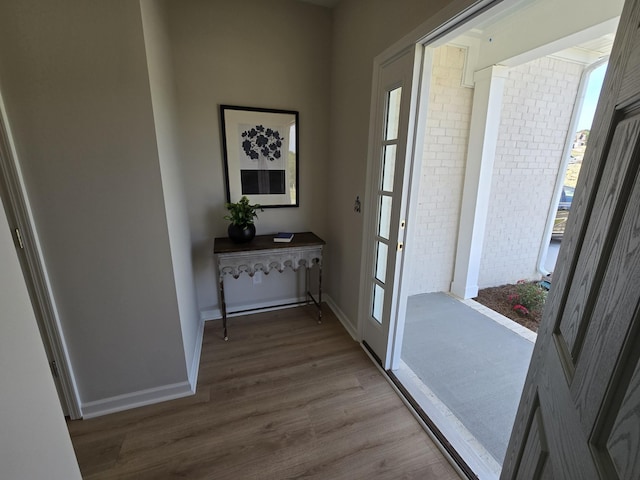 doorway with hardwood / wood-style floors