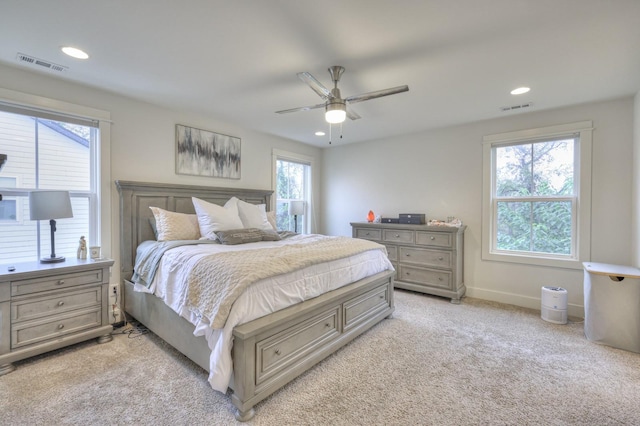 bedroom with light colored carpet and ceiling fan