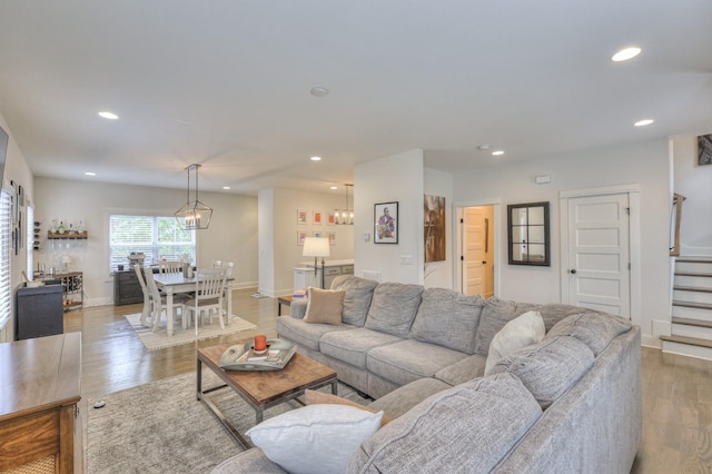 living room with wood-type flooring and bar area