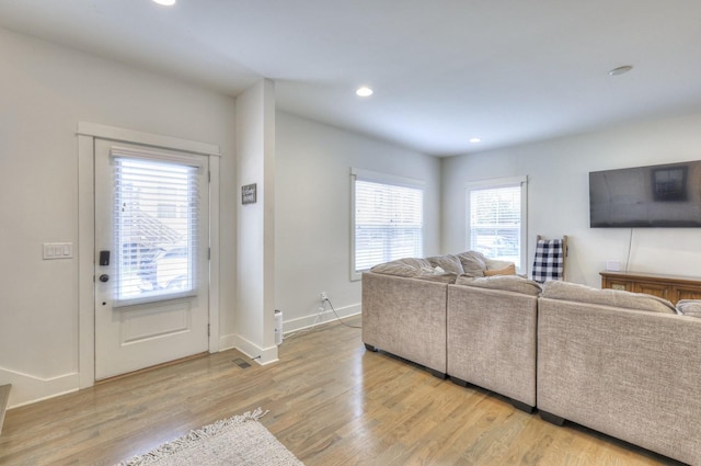 living room with light hardwood / wood-style flooring