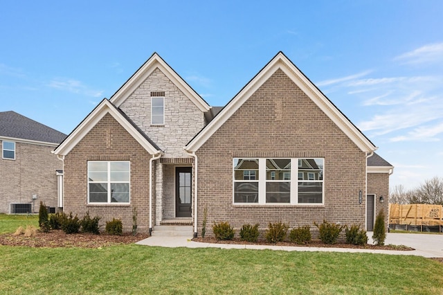 view of front of house featuring central AC and a front lawn