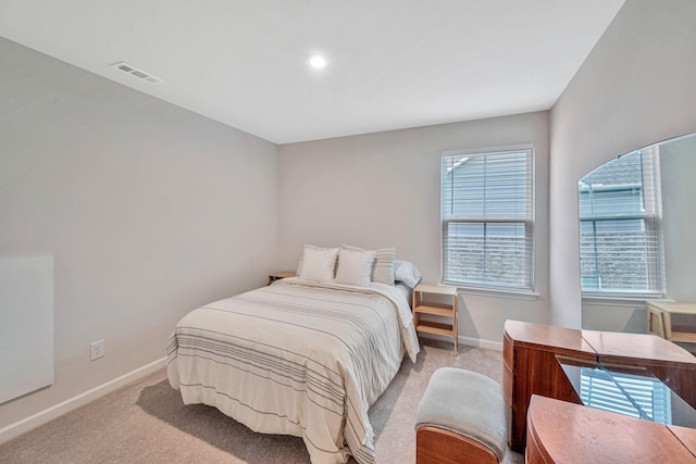 bedroom with light colored carpet