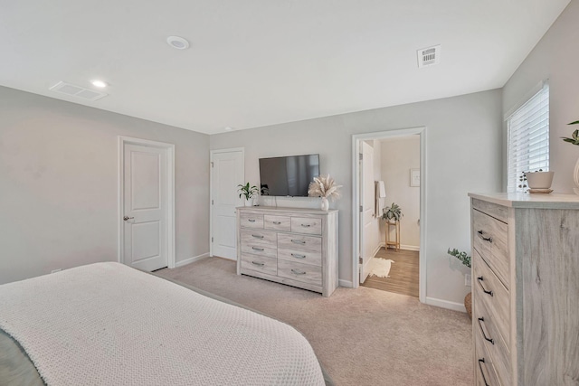 bedroom with light carpet