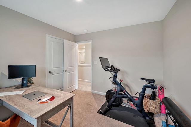 exercise room with light carpet