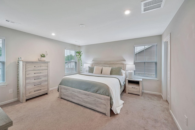 bedroom with light carpet