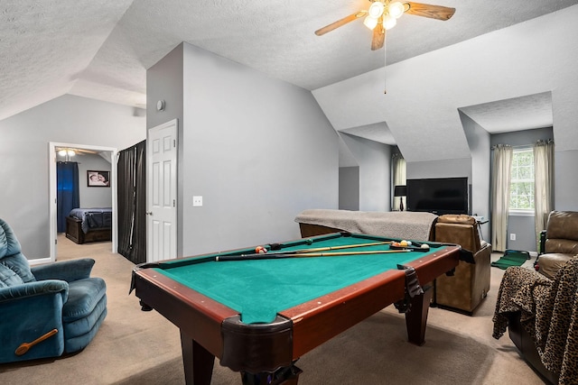 rec room featuring ceiling fan, billiards, light colored carpet, a textured ceiling, and lofted ceiling