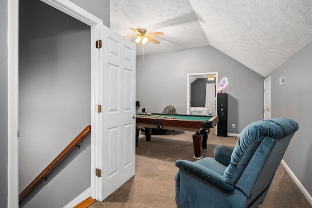 rec room featuring billiards, vaulted ceiling, carpet flooring, ceiling fan, and a textured ceiling