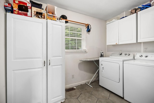 laundry area featuring cabinets and independent washer and dryer