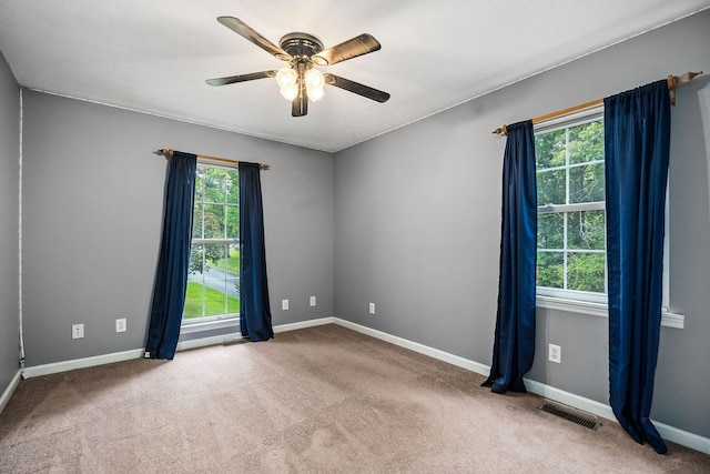 carpeted empty room with ceiling fan