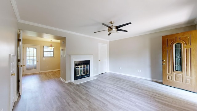 unfurnished living room featuring ceiling fan, light wood-type flooring, and crown molding