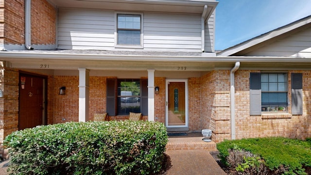 doorway to property with covered porch