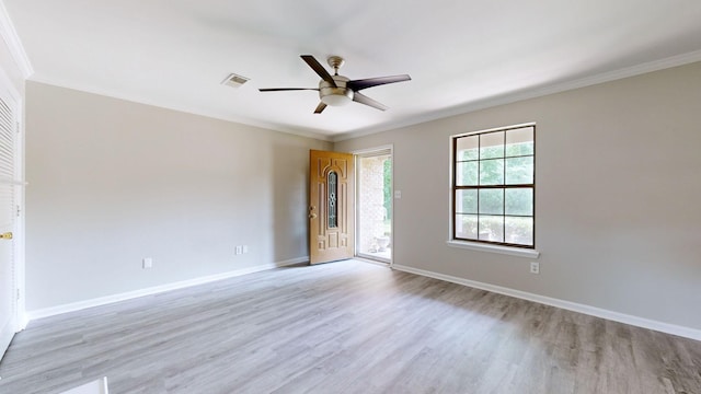 unfurnished room with ceiling fan, light hardwood / wood-style floors, and crown molding