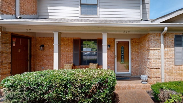 doorway to property featuring covered porch