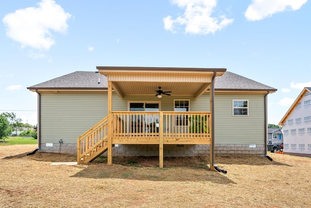 rear view of house with ceiling fan and a deck