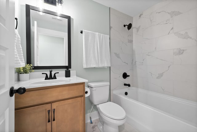 full bathroom featuring toilet, vanity, and tiled shower / bath