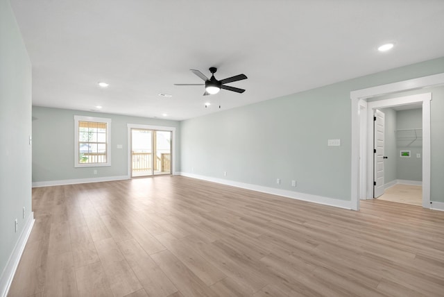 empty room featuring light wood-type flooring and ceiling fan