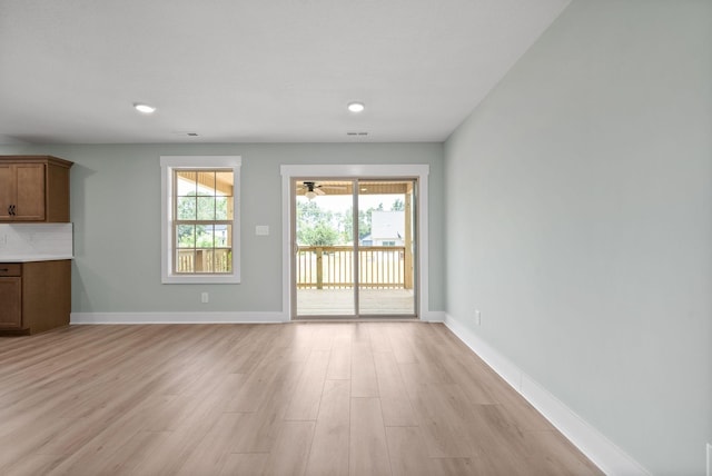 unfurnished living room featuring light wood-type flooring