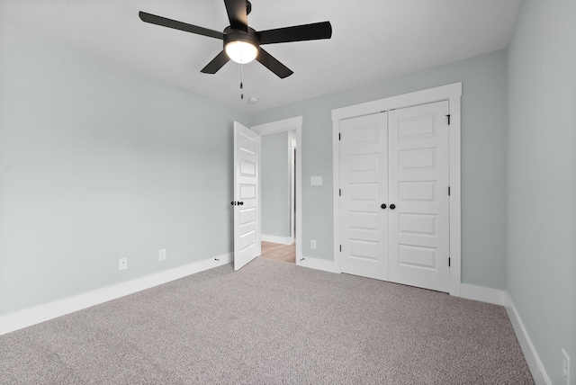 unfurnished bedroom with light carpet, a closet, and ceiling fan