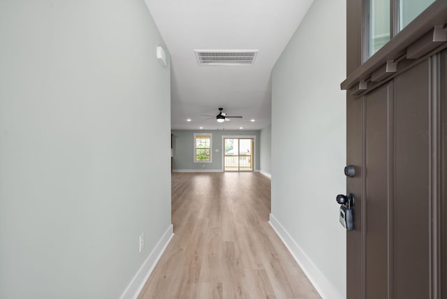 hallway with light wood-type flooring