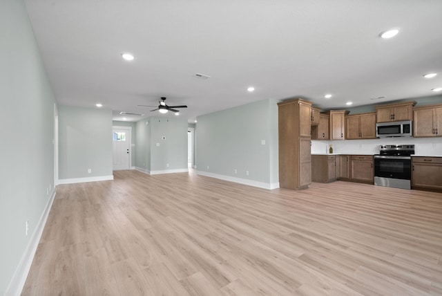 kitchen with ceiling fan, light hardwood / wood-style flooring, and stainless steel appliances