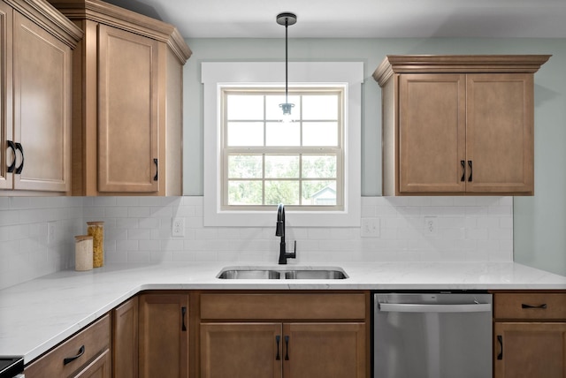 kitchen featuring dishwasher, backsplash, decorative light fixtures, and sink