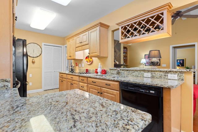 kitchen featuring kitchen peninsula, ceiling fan, sink, and black appliances