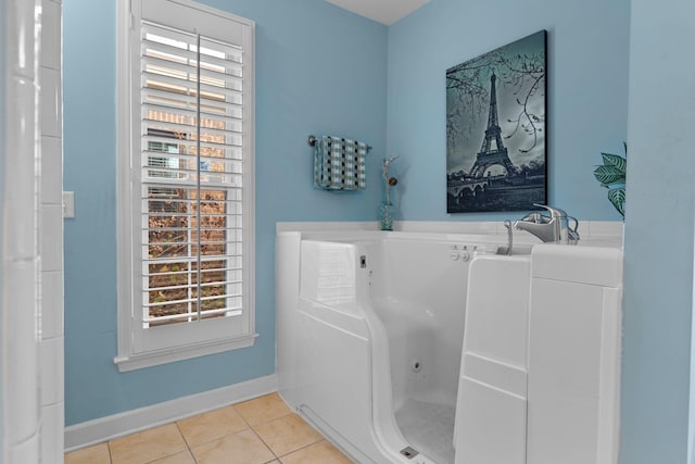 bathroom featuring tile patterned floors and a bathtub