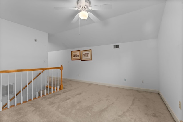 bonus room with carpet flooring, ceiling fan, and vaulted ceiling