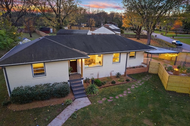 view of front of house with a lawn