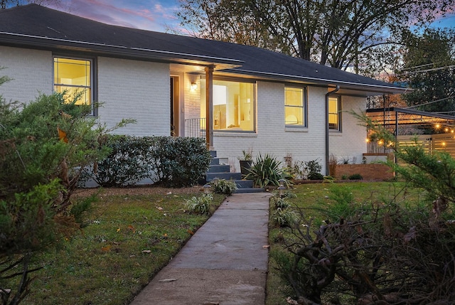 view of front of home with a lawn