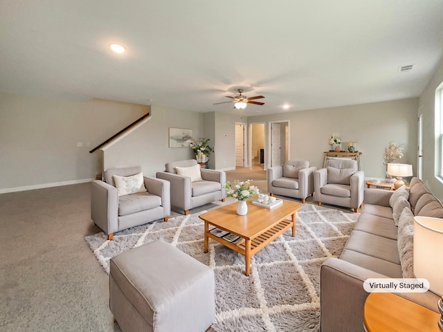 living room with light colored carpet and ceiling fan