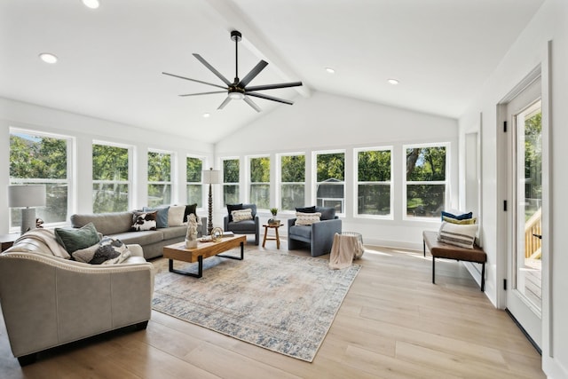 sunroom / solarium featuring lofted ceiling with beams and ceiling fan