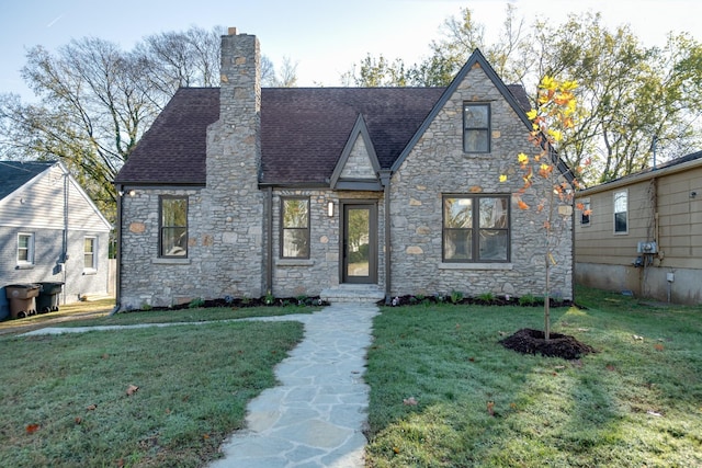 tudor house with a front yard