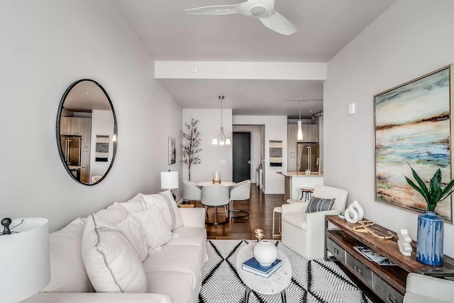 living room featuring hardwood / wood-style floors and ceiling fan