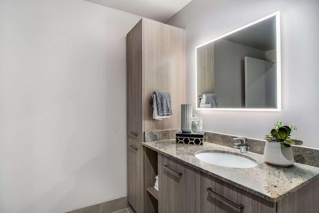 bathroom featuring tile patterned floors and vanity