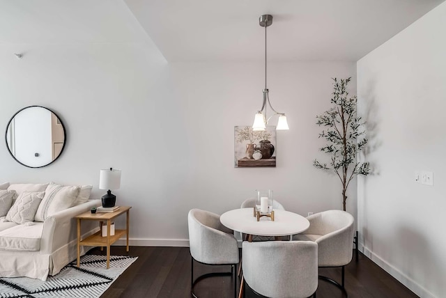 dining area featuring dark wood-type flooring