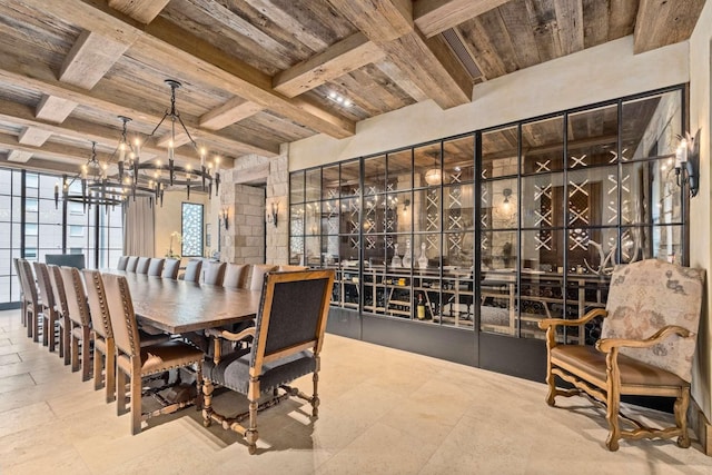 dining space featuring beam ceiling, wooden ceiling, and a chandelier