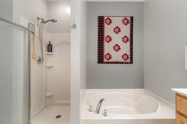 bathroom featuring vanity and separate shower and tub