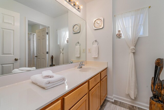 bathroom featuring hardwood / wood-style floors and vanity