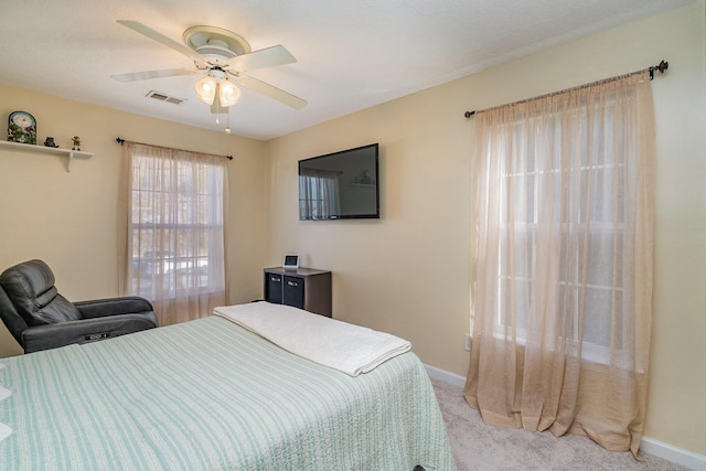 bedroom featuring ceiling fan and light colored carpet