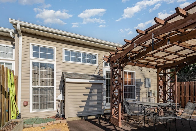 wooden terrace with a pergola