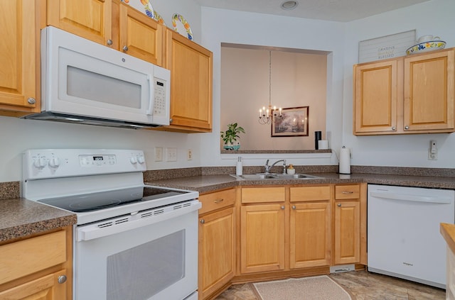 kitchen with sink, decorative light fixtures, white appliances, and an inviting chandelier