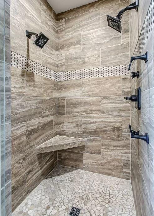 bathroom with tiled shower