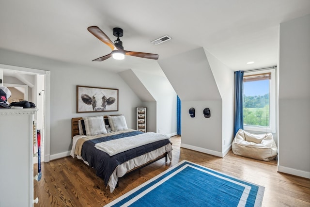 bedroom featuring ceiling fan, lofted ceiling, and dark wood-type flooring