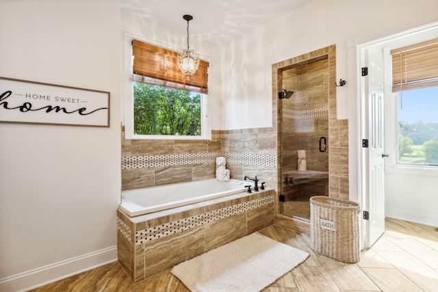 bathroom featuring shower with separate bathtub