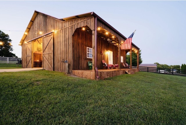 exterior space featuring a yard and an outdoor structure