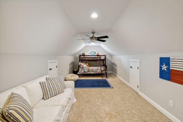 carpeted bedroom featuring ceiling fan and vaulted ceiling