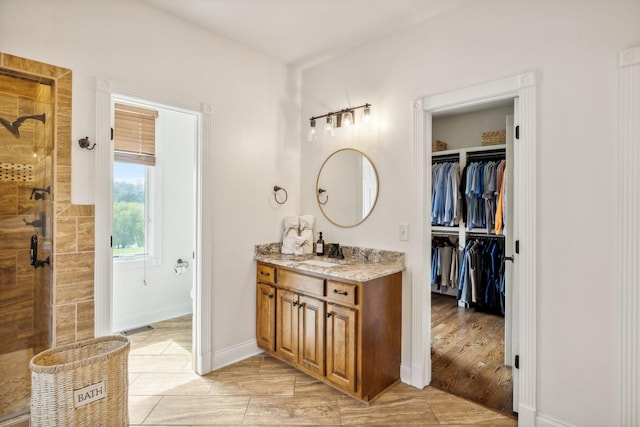 bathroom with vanity and an enclosed shower