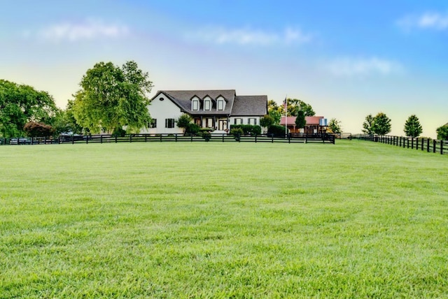 view of yard with a rural view