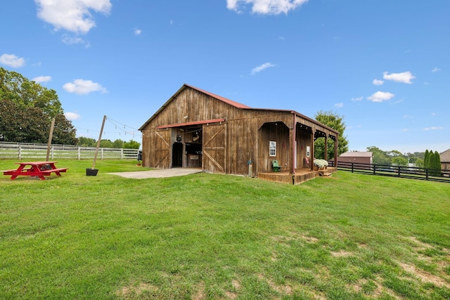 view of stable featuring a rural view